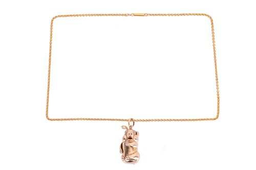 Lot 66 - A diamond-set kinetic pig pendant on chain,...