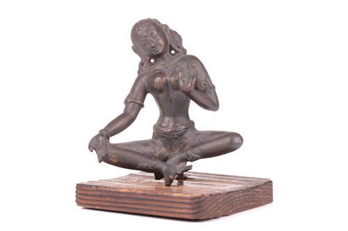 Lot 96 - An Indian cast bronze figure of a seated...