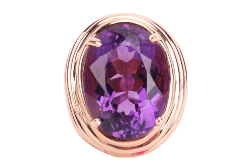Lot 117 - A large amethyst cocktail ring, centred with...