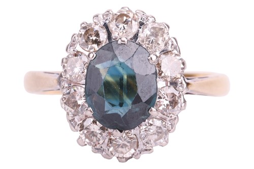 Lot 51 - A sapphire and diamond cluster ring, claw-set...