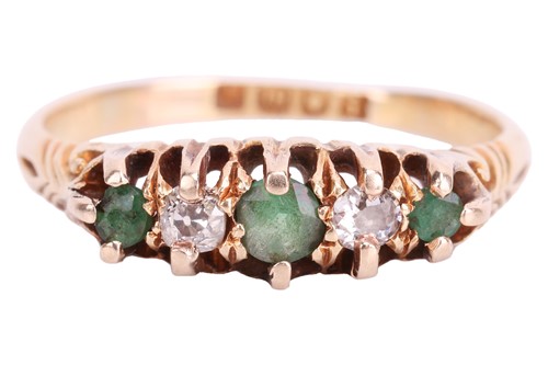Lot 42 - An Edwardian emerald and diamond half-hoop...