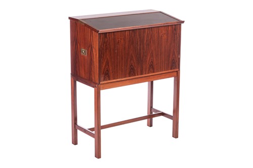 Lot 205 - A 1970s Dyrlund rosewood reading desk/bar, the...