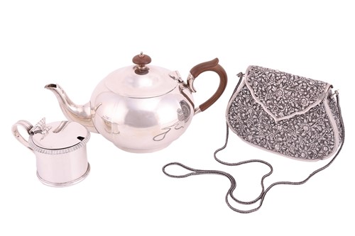 Lot 259 - A silver teapot, circular panelled form with...