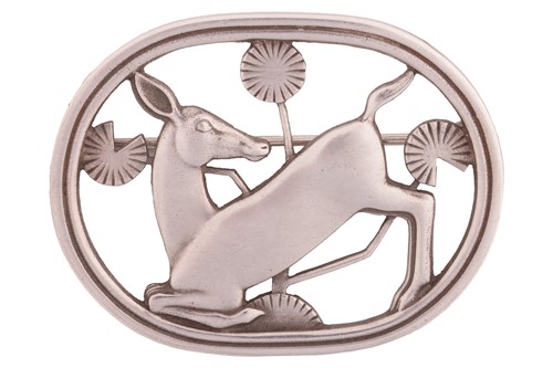 Lot 172 - Georg Jensen - A brooch depicting kneeling...