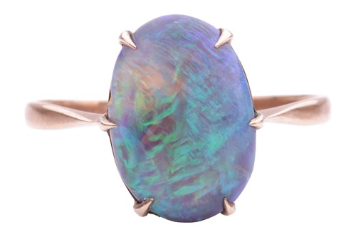 Lot 97 - A black opal dress ring, featuring an oval...