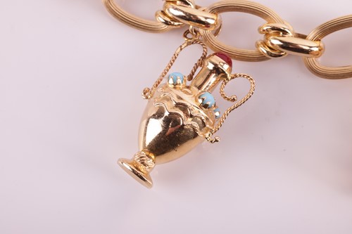 Lot 143 - A charm bracelet comprising a series of hollow...