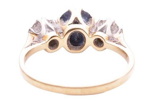 Lot 153 - A sapphire and diamond three stone ring, set...