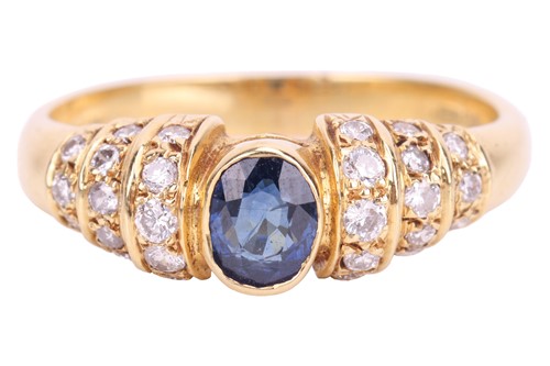 Lot 93 - A sapphire and diamond ring, set with an oval...