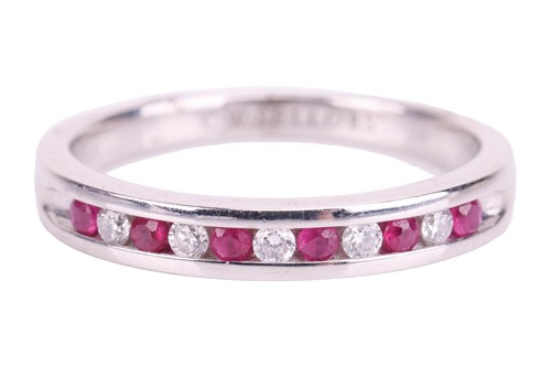 Lot 52 - A ruby and diamond half-eternity ring in 18ct...