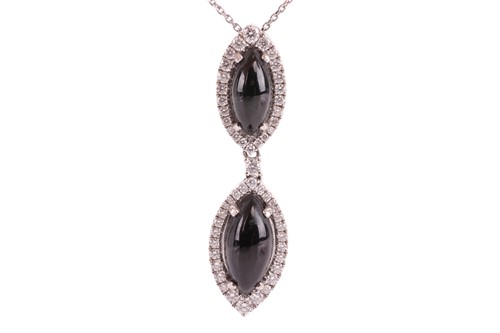 Lot 108 - A Whitby jet and diamond pendant on chain,...
