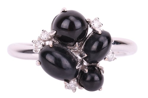 Lot 46 - A Whitby jet cabochon cluster ring in 18ct...
