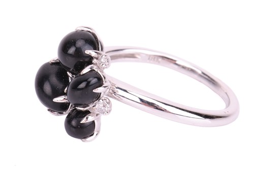 Lot 46 - A Whitby jet cabochon cluster ring in 18ct...