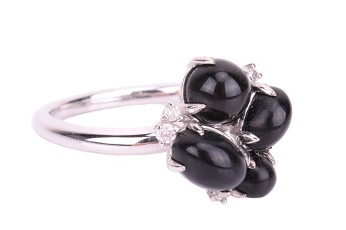 Lot 46 - A Whitby jet cabochon cluster ring in 18ct...