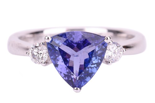 Lot 61 - A trilliant-cut tanzanite and diamond ring in...