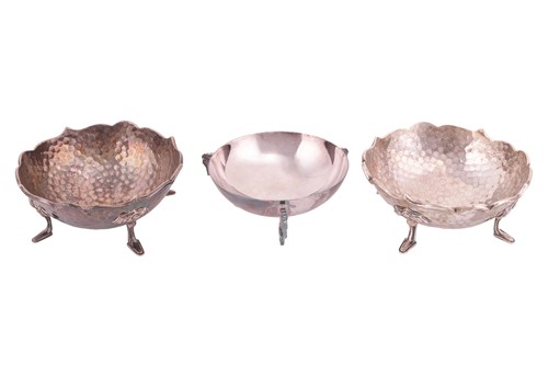Lot 74 - A pair of Arts and Crafts silver bonbon dishes,...