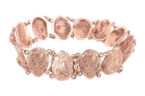 Lot 159 - A textured mollusc link bracelet; comprising...