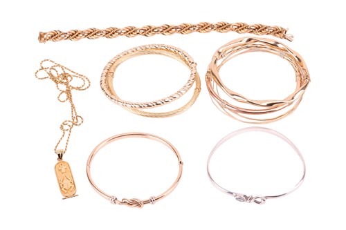 Lot 124 - A collection of bangles, including a rope...
