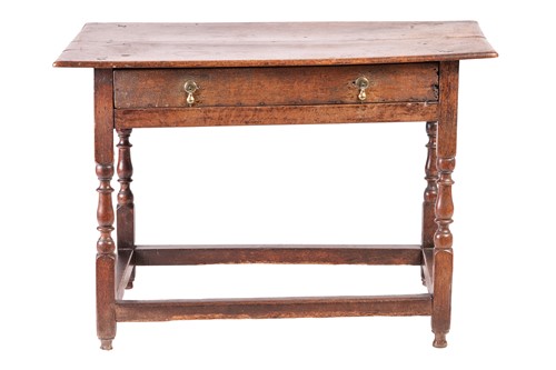 Lot 109A - A late 17th-century single-drawer oak side...