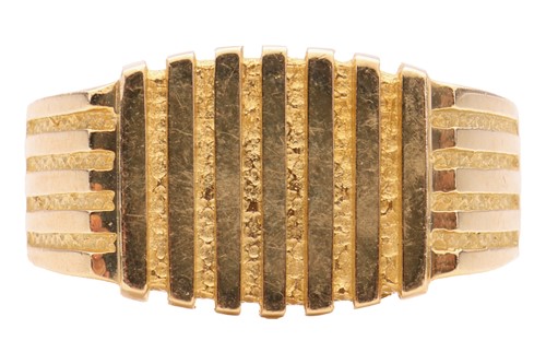 Lot 155 - A signet ring with parallel ridged decoration,...