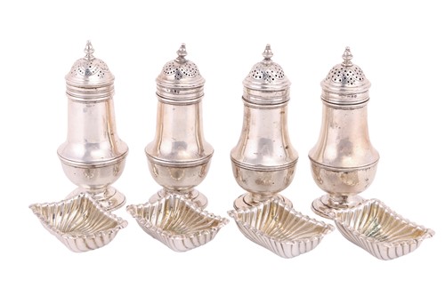 Lot 18 - A set of four silver pepperettes of baluster...
