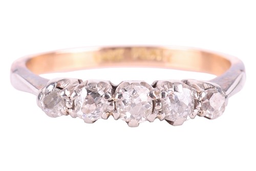 Lot A diamond five stone ring, set with a row of...