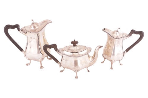 Lot 64 - A matched three-piece tea service; comprising...