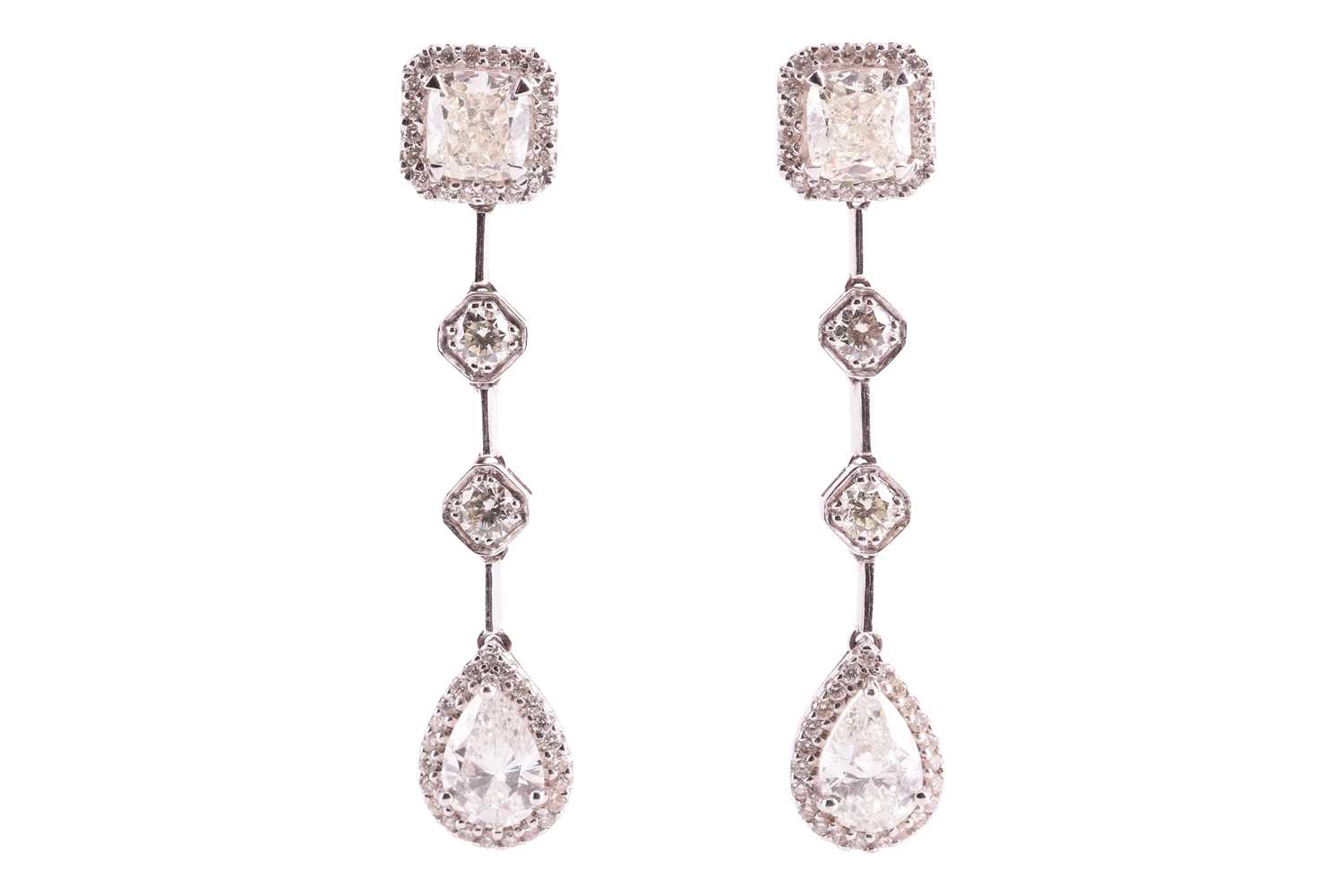 Lot 171 - A pair of diamond set drop earrings, featuring...