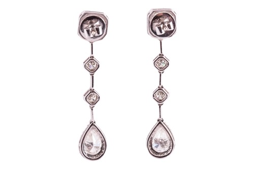 Lot 171 - A pair of diamond set drop earrings, featuring...