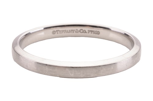 Lot 161 - Tiffany & Co. - a wedding band with a matte...