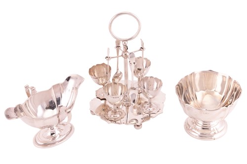 Lot 237 - An Edwardian silver egg cruet for four, a...