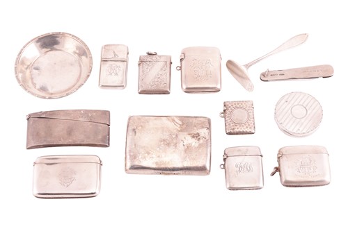 Lot 84 - Seven silver vesta cases, a curved cigarette...