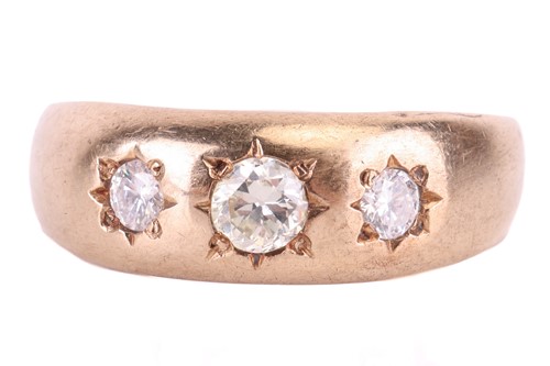 Lot 12 - A diamond-set gypsy ring, featuring three star-...
