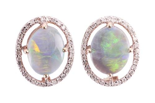 Lot 103 - A pair of opal and diamond halo stud earrings...