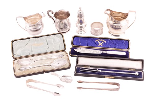Lot 86 - Two George III silver creamers both stippled...