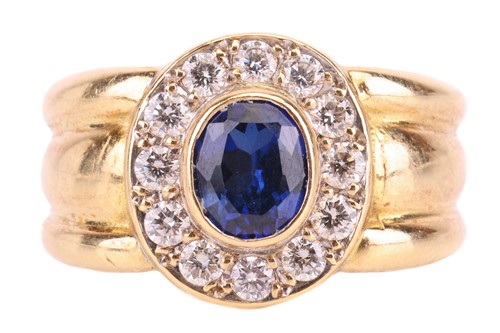 Lot 160 - A synthetic sapphire and diamond halo ring,...