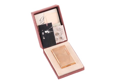 Lot 131 - An S T Dupont De Paris gold plated lighter in...