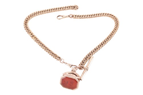 Lot 120 - An Albert chain and fob, the yellow metal curb...