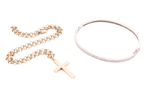 Lot 121 - A diamond set bangle and a gold cross on a...