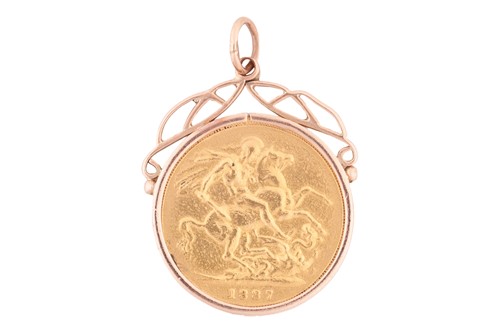 Lot 122 - An 1887 Victoria full sovereign in a 9ct gold...