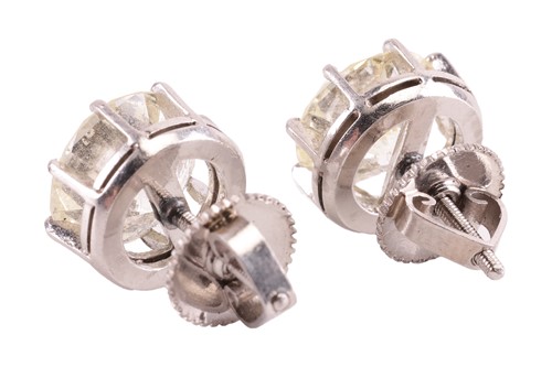 Lot 170 - A pair of diamond stud earrings, featuring two...