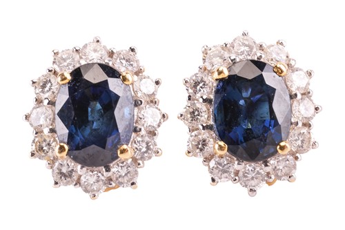 Lot 27 - A pair of sapphire and diamond cluster...