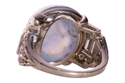 Lot 137 - A star sapphire and diamond ring, circa 1950s,...