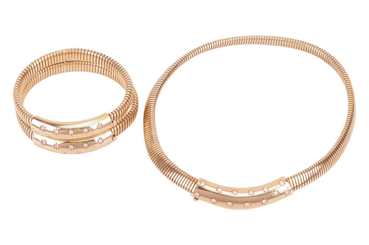 Lot 124 - A diamond set necklace and bracelet suite, the...