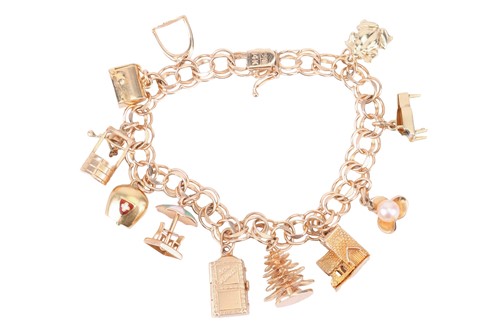 Lot A charm bracelet with a variety of charms...
