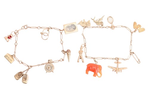 Lot 39 - Two charm bracelets with a variety of charms;...