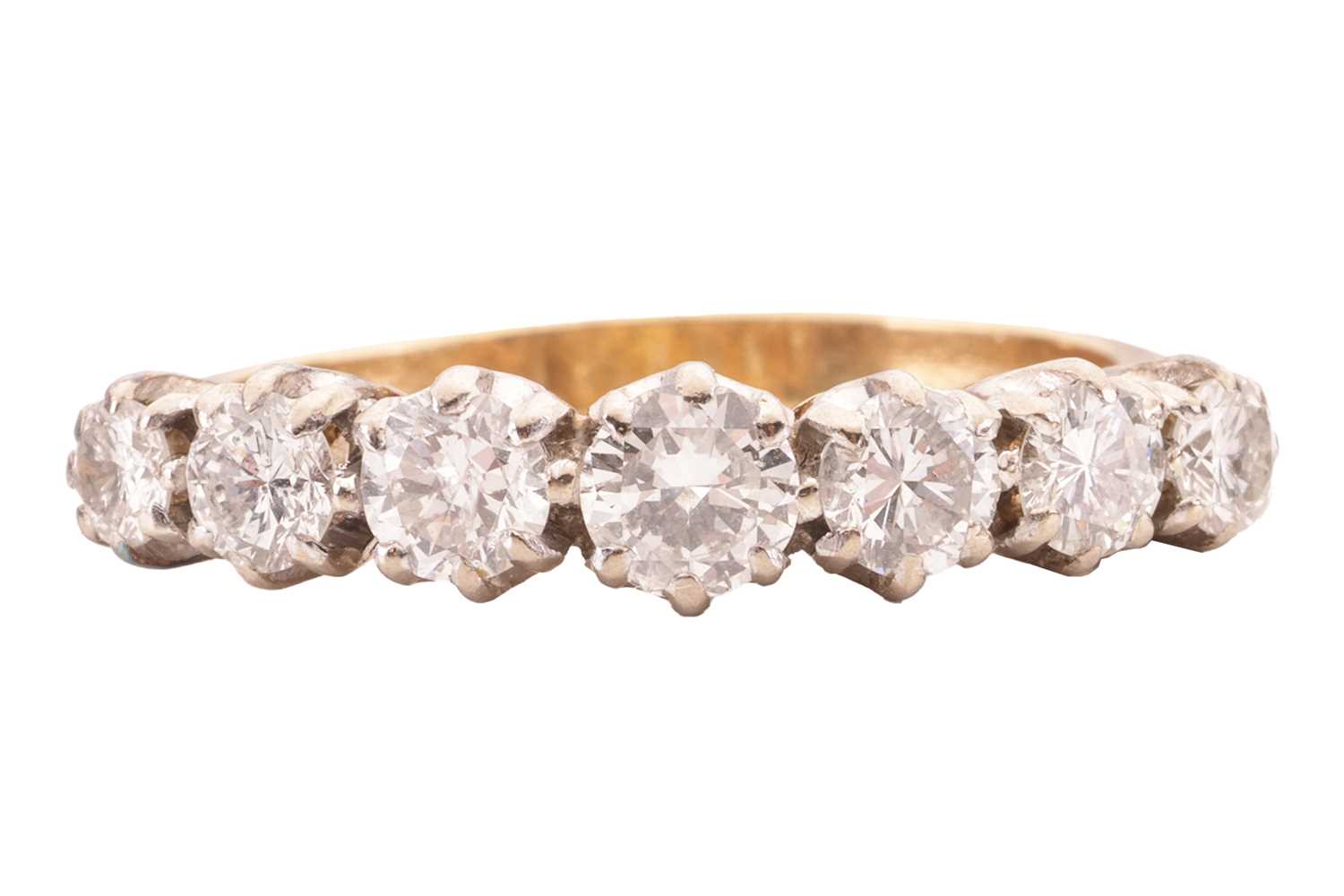 Lot 29 - A seven-stone diamond ring, featuring seven...