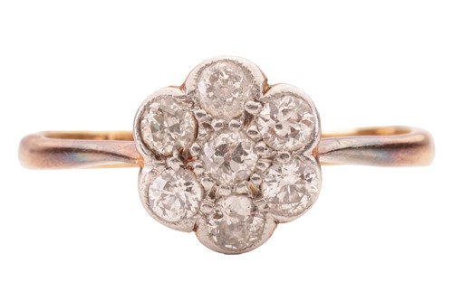 Lot 46 - A diamond-set daisy head ring, set with seven...