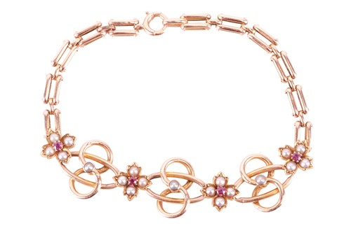 Lot 9 - An Edwardian floral link bracelet set with...