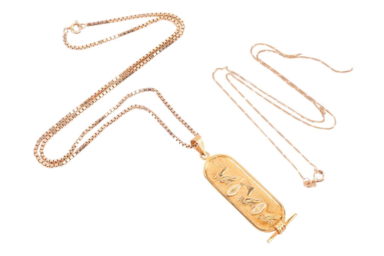Lot 158 - An Egyptian revival yellow metal pendant and...