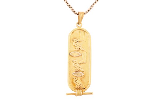 Lot 158 - An Egyptian revival yellow metal pendant and...